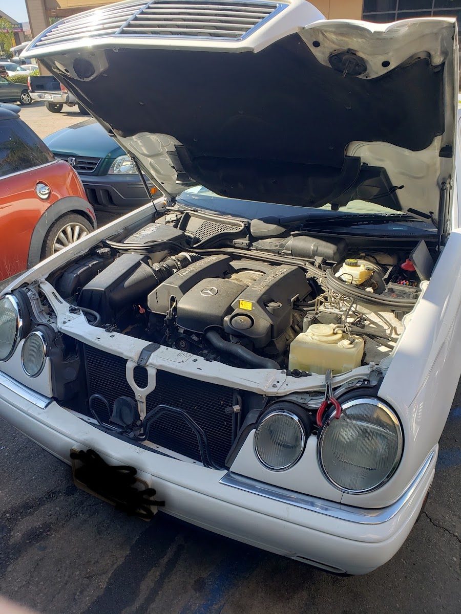 Mercedes-Benz with the hood open for engine work